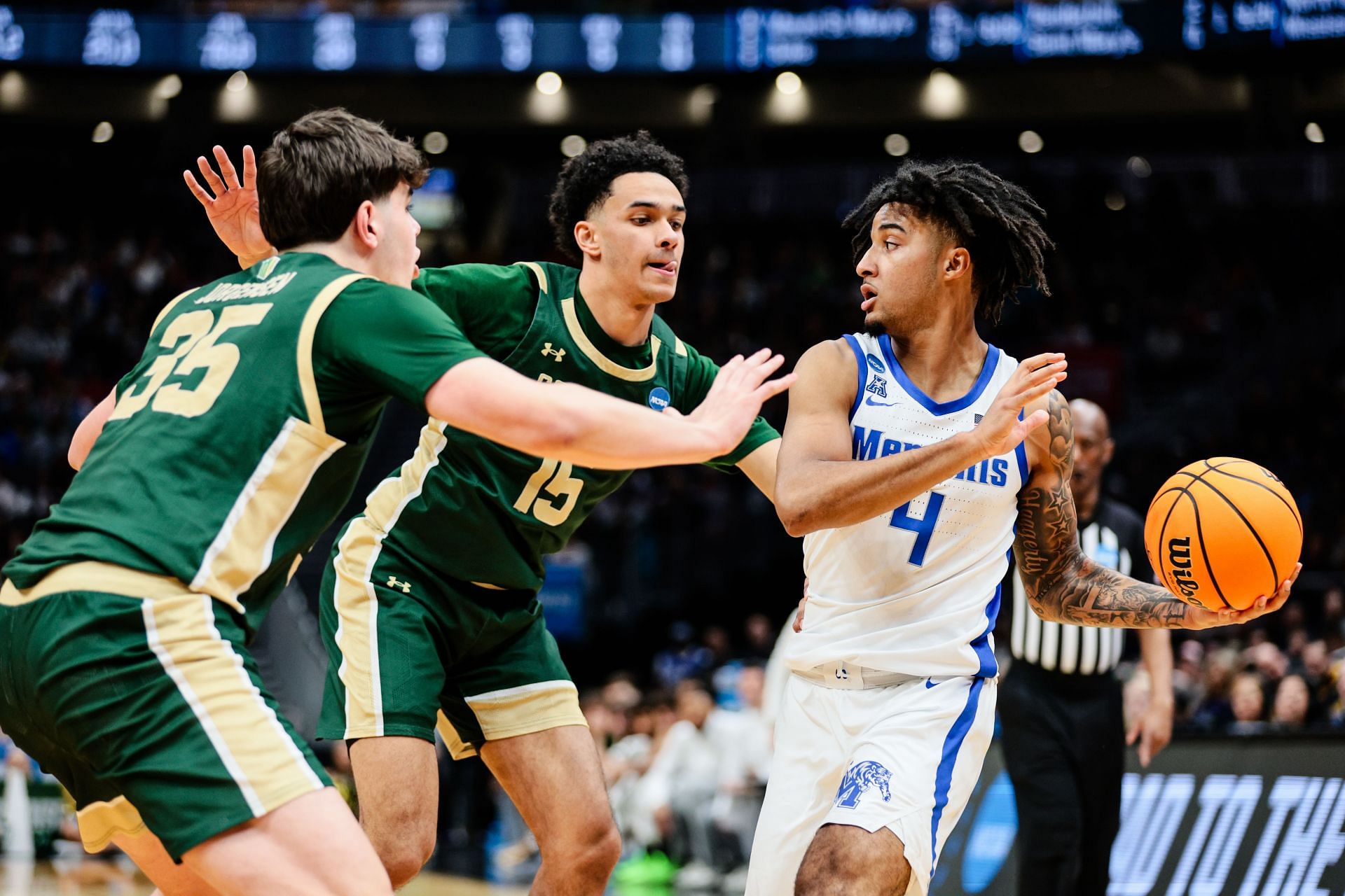PJ Haggerty (#4) of the Memphis Tigers looks for a pass during the second half of the game against the Colorado State Rams in the first round of the 2025 NCAA Tournament. Photo: Getty